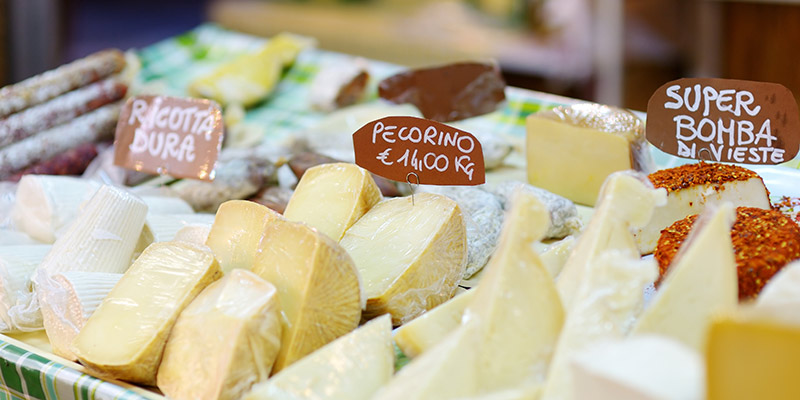 A stall front displaying pecorino and other cheeses