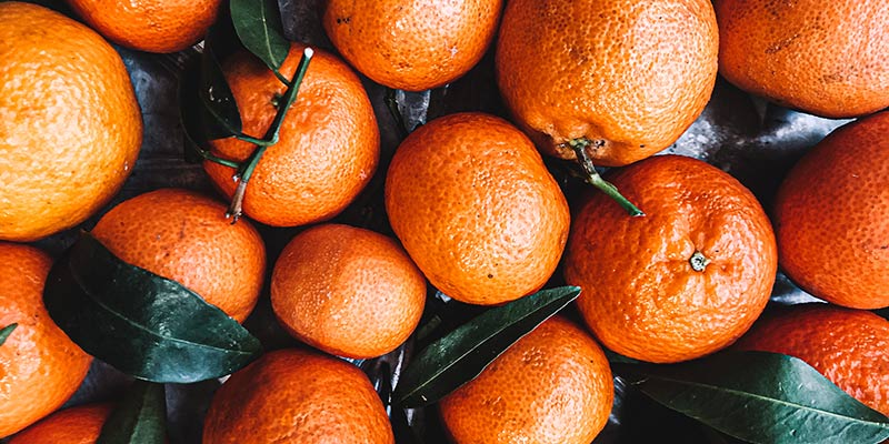 A counter full of oranges
