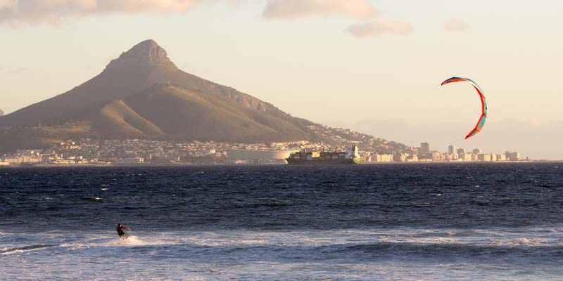 Someone wind surfing on the ocean