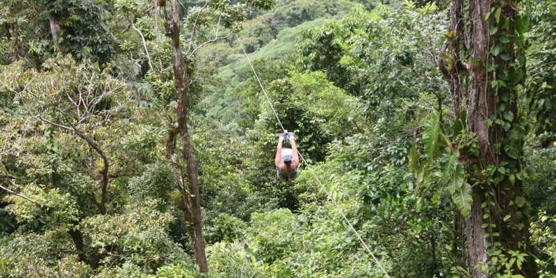Teenager Zip lining at the Four Seasons Costa Rica