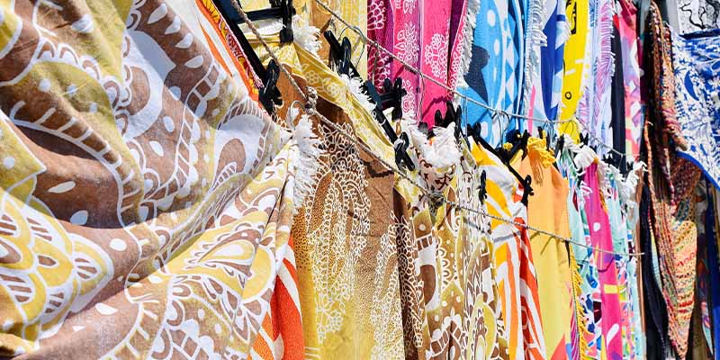 A row of hanging textiles
