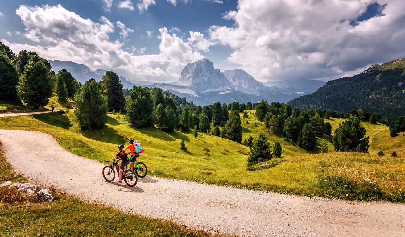 Riding a bike in the Alpine country side in Italy