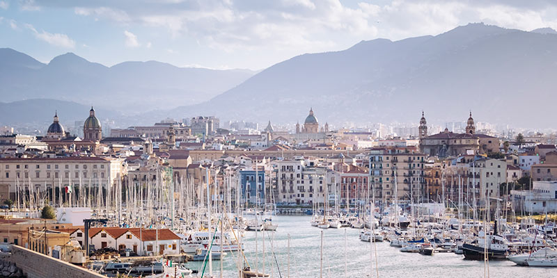A mountain range behind a city