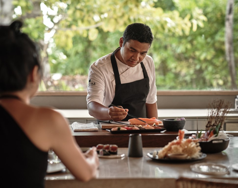 Chef preparing a dish at Patina restaurant