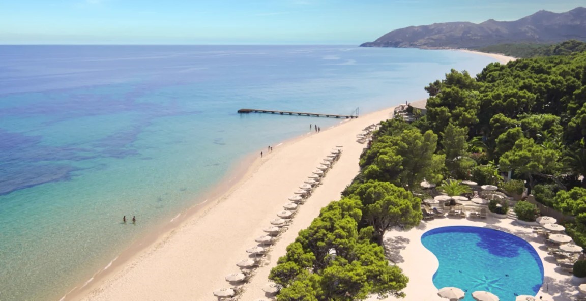 View of the beach and pool at Forte Village Resort in Sardinia, Italy