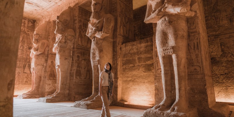 Woman walking inside Abu Simbel Temple