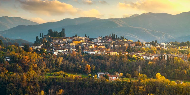 The medieval village Barga with mountains in the background