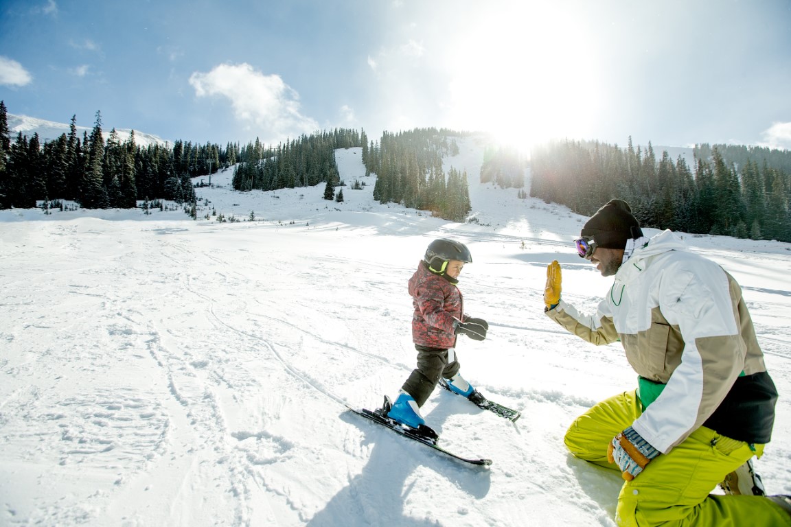 a toddler learning to ski