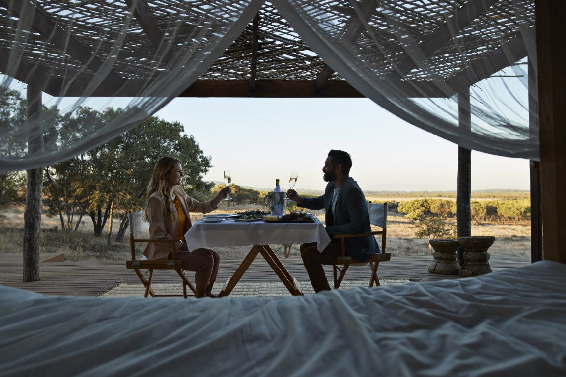 a couple at a luxury safari lodge