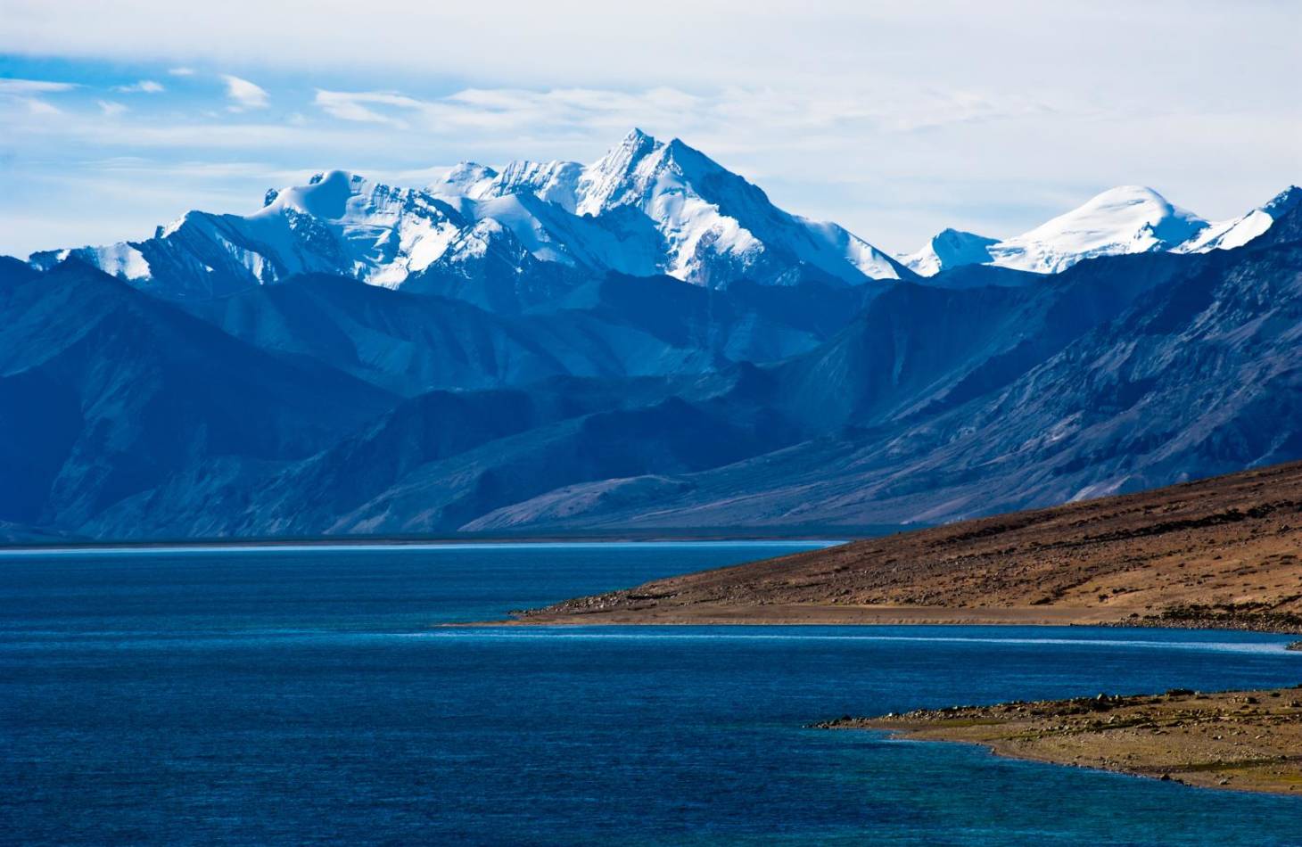 Pangong Lake and mountains with clear blue sky, it's a highest saline water lake in Himalayas range near Leh