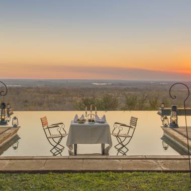 Main pool during sunset at Stanley Safari lodge in Zambia