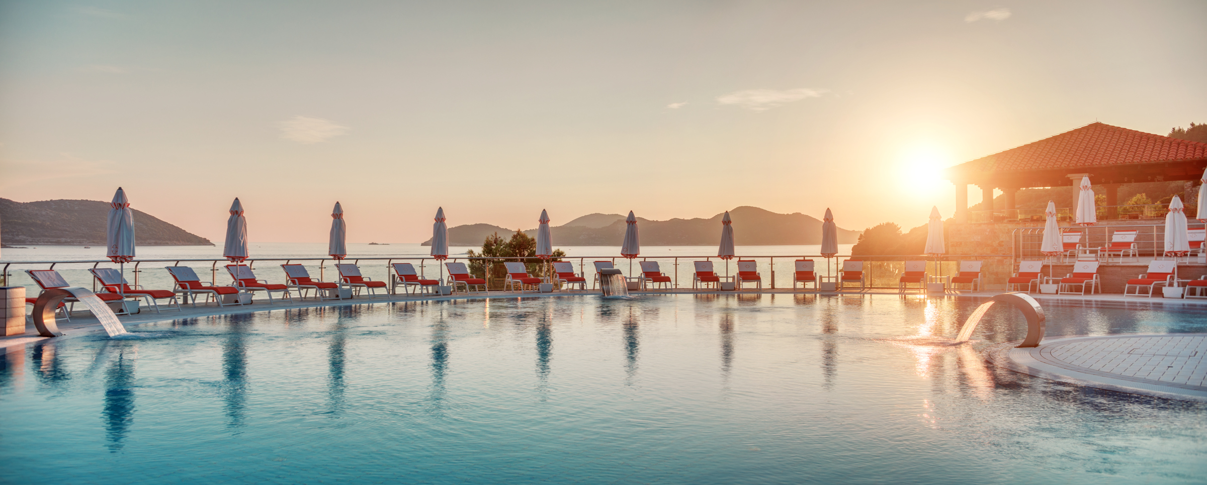 Main pool with the sun setting in the background in Sun Gardens hotel in Croatia
