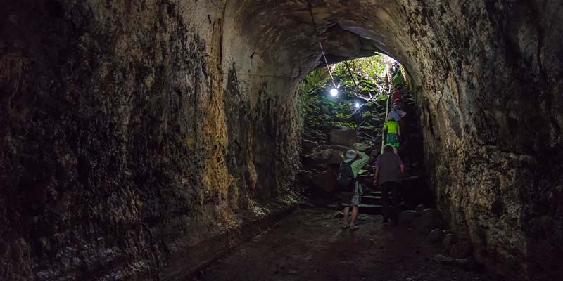 A tour group exploring the lava tunnels