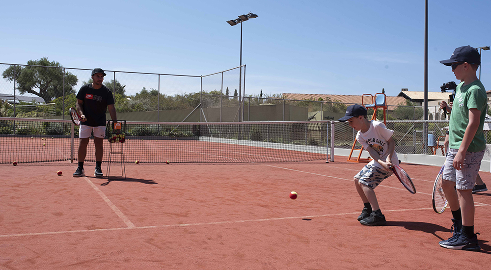 Kids playing tennis at Costa Navarino