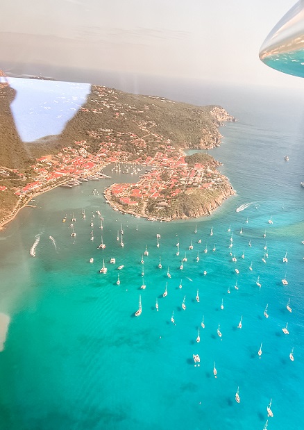 Aerial view of St. Barths outside of an airplane window