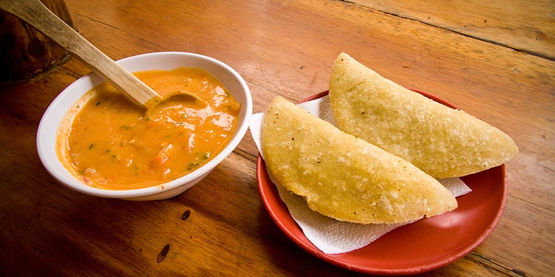 A plate of Empanadas and soup