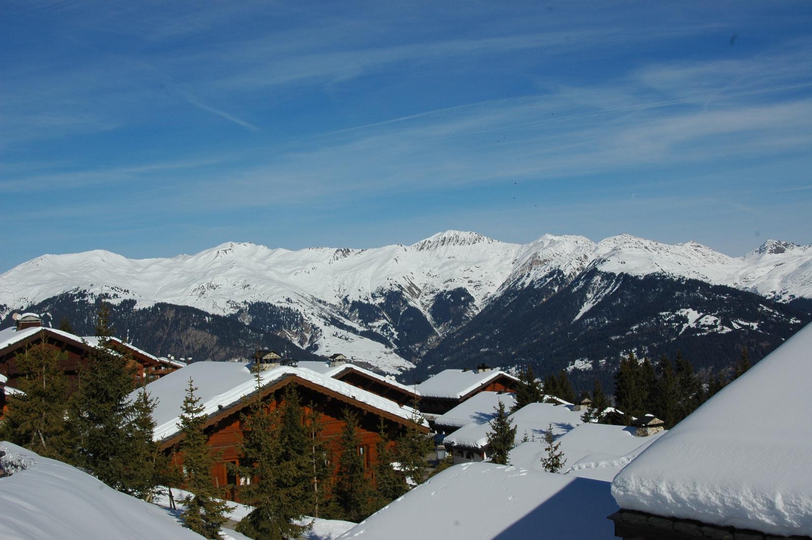 Snow covered cabins and mountains in Courchevel 1650