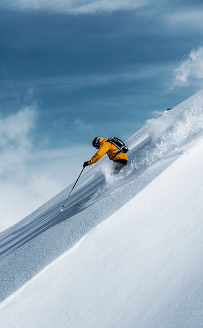 Person skiiing down mountain