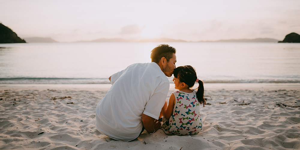 Father and daughter on the beach in Okinawa