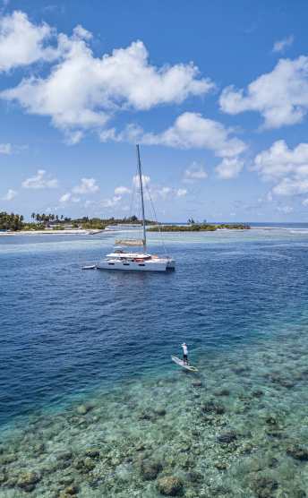 Catamaran in the blue waters of South Male Atoll in the Maldives