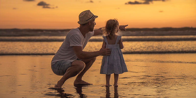 Father and daughter at the beach