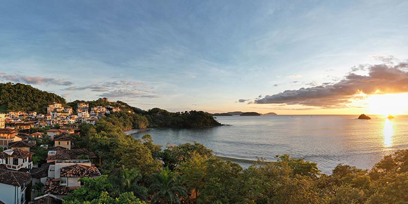 A town on a hill overlooking the ocean