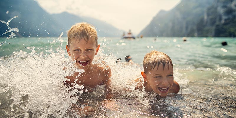 Two young boys playing in the water