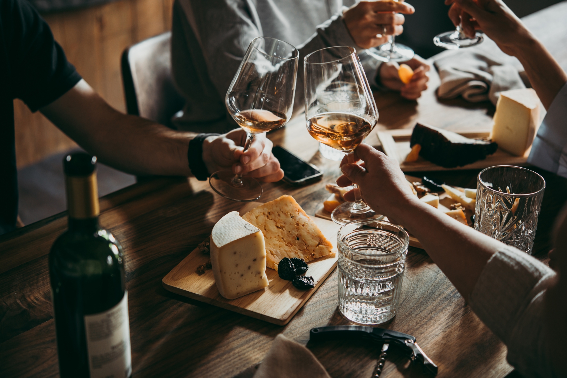 A group enjoying cheese and wine in La Fruitiere restaurant