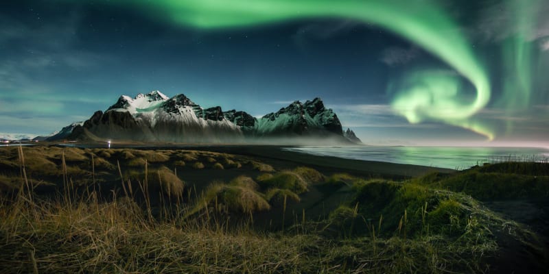 Northern lights over mountain