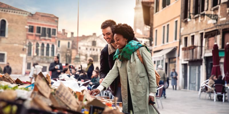 Couple smiling at market stall