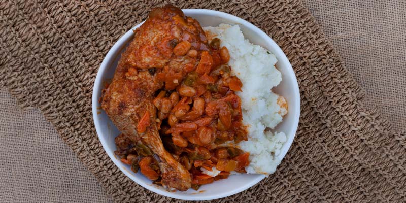 Chakalaka and pap dish on a canvas mat