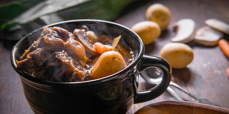 Potjiekos served in a mug