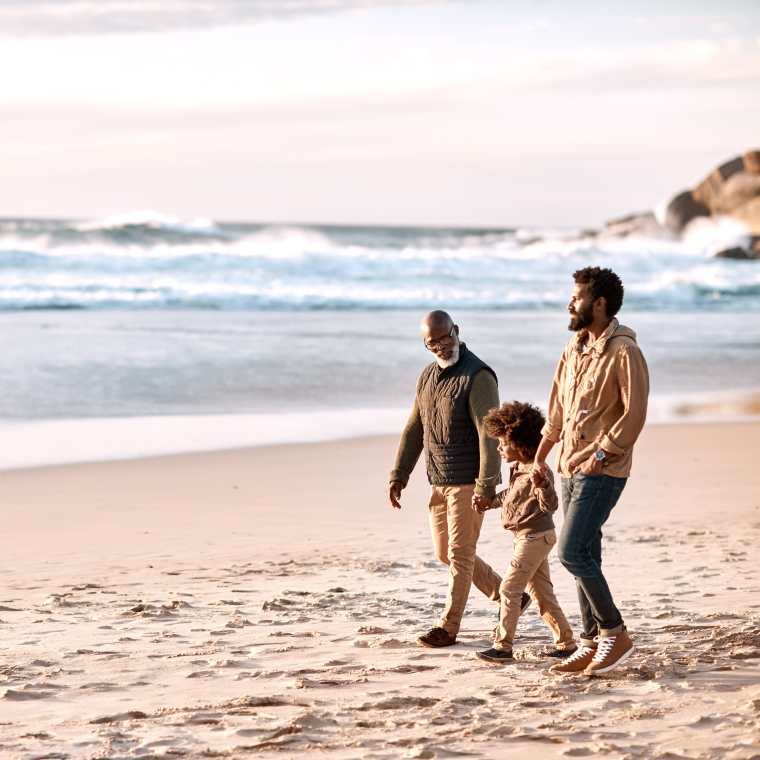 a family walking on the beach in Cape Town