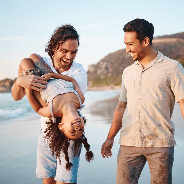 an LGBT family on the beach